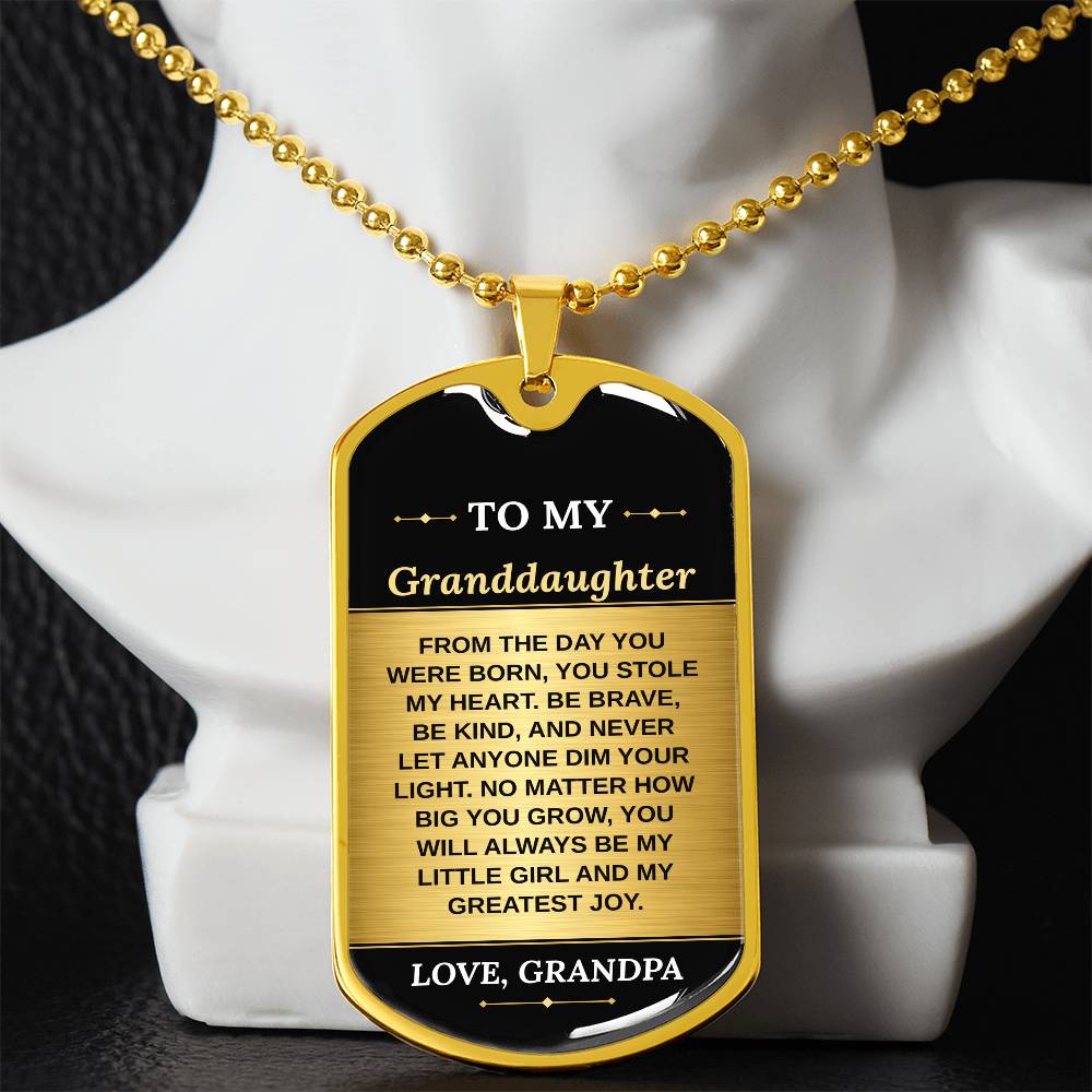 To My Granddaughter Necklace from Grandpa – gold dog tag necklace displayed on a bust