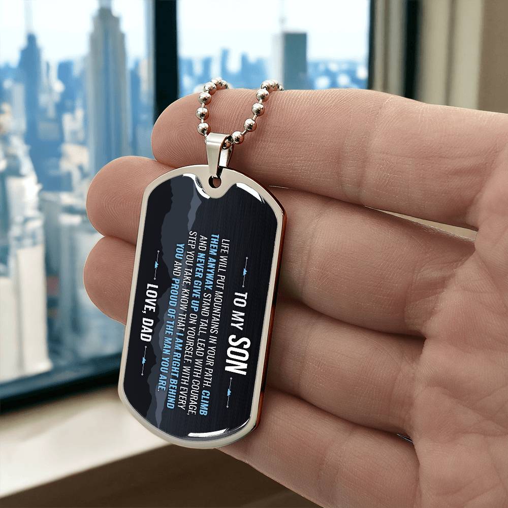 To My Son Necklace from Dad – silver dog tag held in hand to show size