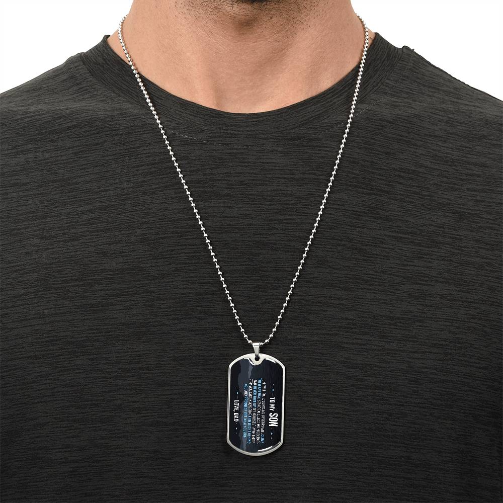 To My Son Necklace from Dad – silver dog tag necklace worn with a dark t-shirt