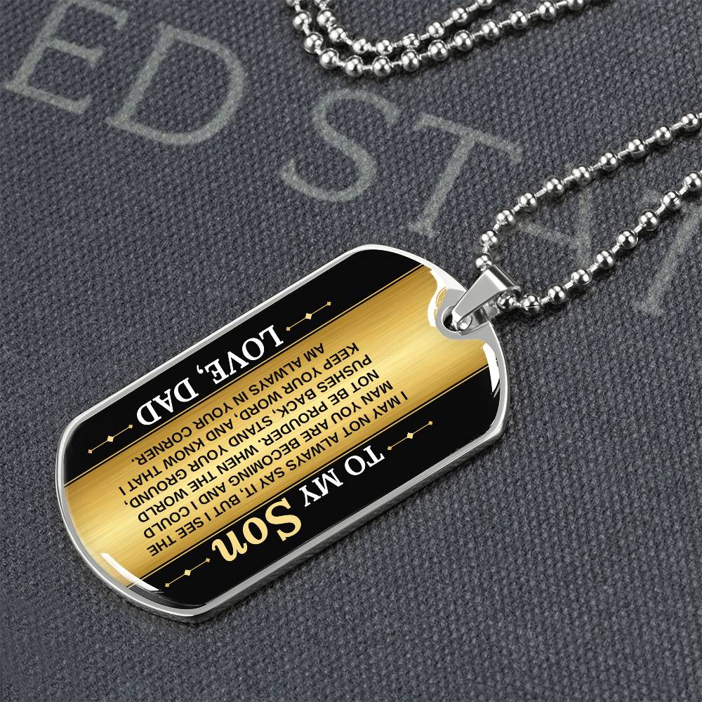 To My Son Necklace from Dad – dog tag necklace laid flat on a dark background
