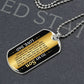 To My Son Necklace from Dad – dog tag necklace laid flat on a dark background