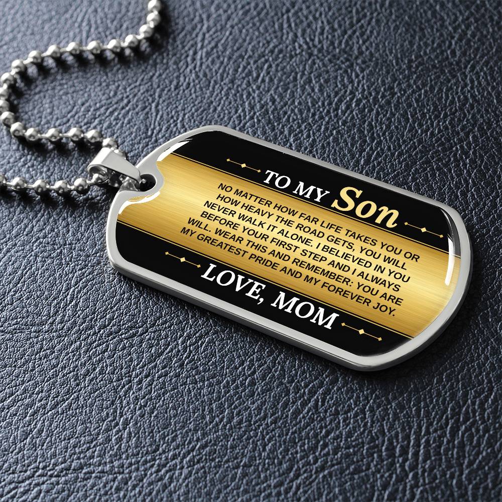 To My Son Necklace from Mom – dog tag necklace laid flat on a dark background