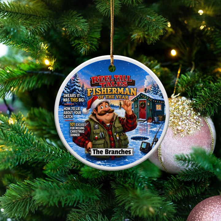 Round ceramic Christmas tree ornament featuring a cartoon fisherman wearing a Santa hat near an ice-fishing cabin.