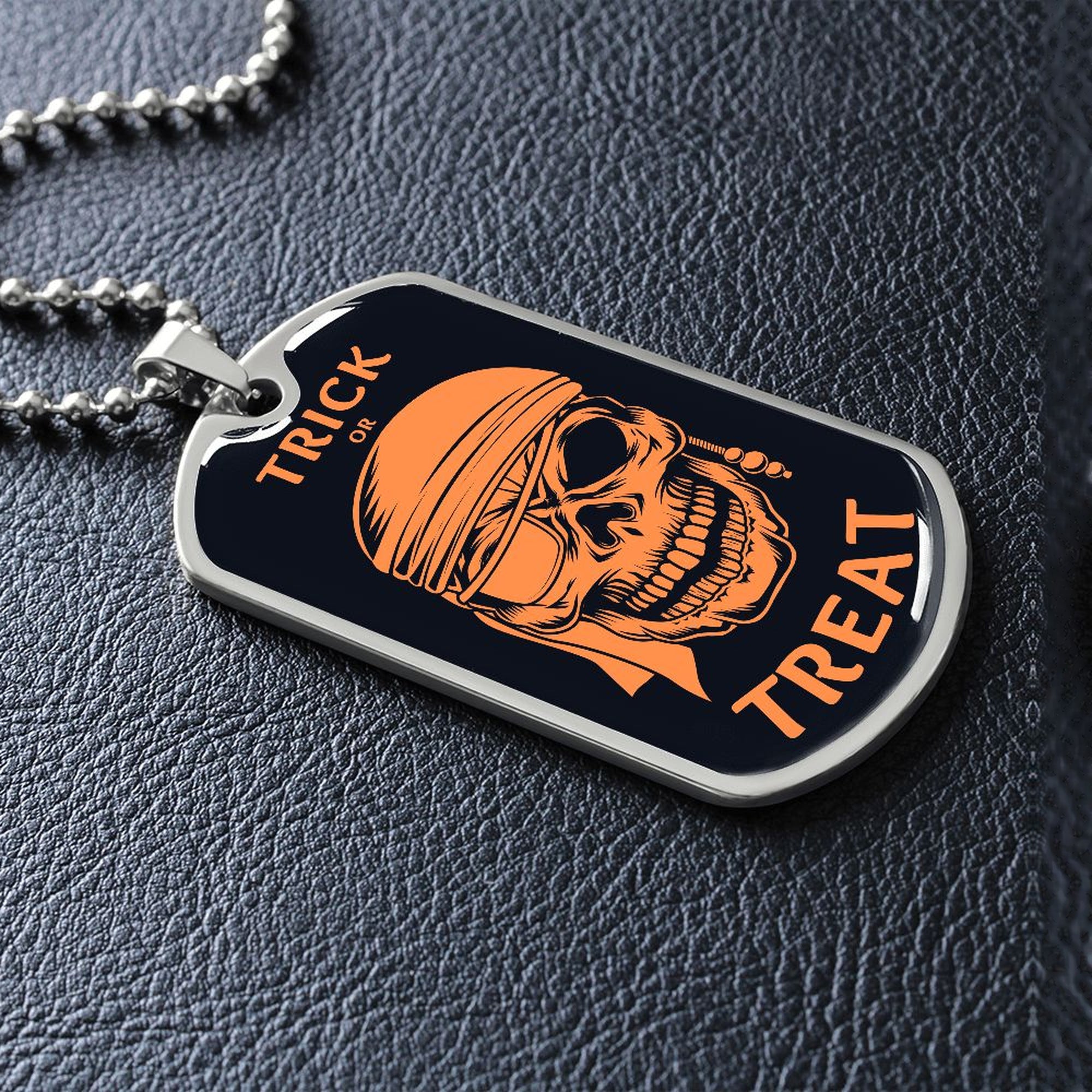 Silver Trick or Treat pirate skull dog tag lying on black leather