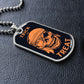 Silver Trick or Treat pirate skull dog tag lying on black leather