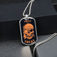 Silver Trick or Treat pirate skull dog tag hanging over a black gift box