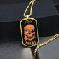 Gold-finish Trick or Treat pirate skull dog tag hanging over a black gift box