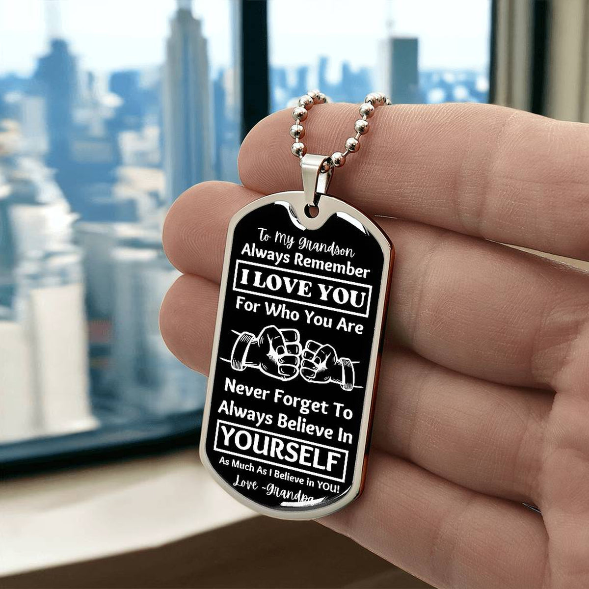 To My Grandson, From Grandpa Dog Tag – silver dog tag held in hand to show size