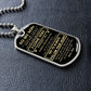 Silver To My Son dog tag lying on black leather
