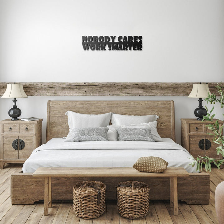 Black Nobody Cares Work Smarter sign above a bed