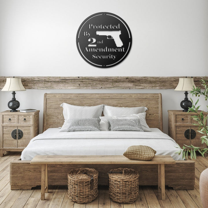 Black Protected by 2nd Amendment sign above a bed