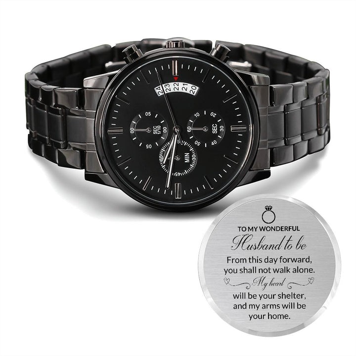 Black Husband To Be chronograph watch beside its engraved back