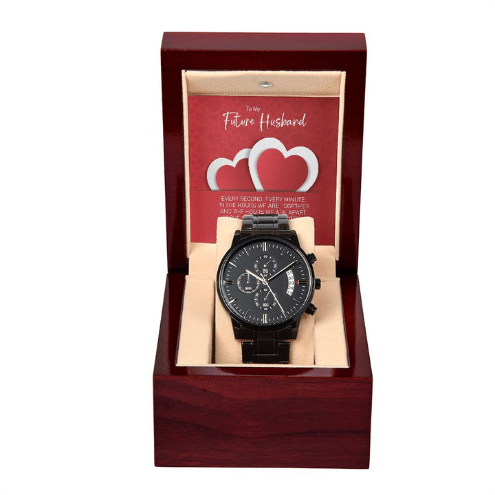 Black chronograph watch in a luxury box